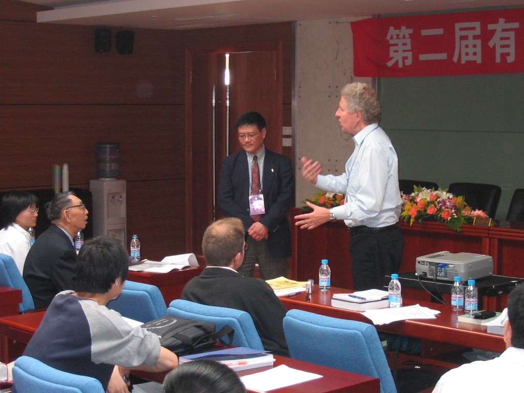 Figure 3. During an aluminum electrolysis conference held in Shenyang in 2004 (L-R): Prof. Qiu Zhuxian; Dr. John J. Chen, University of Auckland; and Dr. Halvor Kvande, Hydro Aluminium.