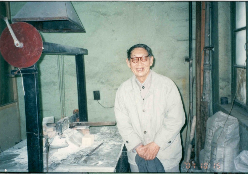 Figure 4. Prof. Qiu Zhuxianand is 1,000 amp laboratory cell that carried out lower temperature aluminum electrolysis in 2001.