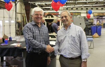 John Barneson (left), senior vice president of Corporate Development at Kaiser Aluminum Corporation, and Chris Joest (Right), president of Imperial Machine & Tool Co., celebrating the successful completion of the acquisition.