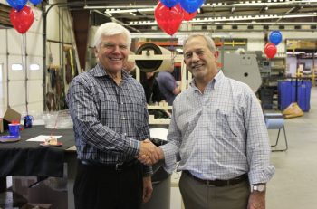John Barneson (left), senior vice president of Corporate Development at Kaiser Aluminum Corporation, and Chris Joest (Right), president of Imperial Machine & Tool Co., celebrating the successful completion of the acquisition.