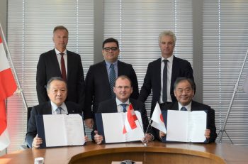 Signing of the sales cooperation agreement in Tokyo — Front row (L-R): Shinichi Kobayashi, managing executive officer and chief operating officer of the Metals & Mineral Resources Div. of Marubeni Corporation; Gerald Mayer, CEO of AMAG; and Akira Suzuki, executive officer of the Automotive Steel Products Div. of Marubeni Itochu Steel — Second row (L-R): Norbert Bürger, managing director of AMAG rolling Gmbh; Victor Breguncci, chief sales officer of AMAG; and Helmut Kaufmann, chief technology officer of AMAG. 