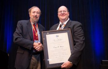 Craig Werner (right), currently vice president extrusion technology at Kaiser Aluminum, received the Mauric H. Roberts Award in 2016.