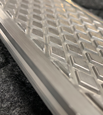 Reliefed Technologies - Example of an aluminum profile with a 3D design imprinted. 