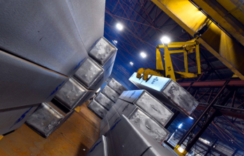 Scepter - tilted view of a storage room with aluminum rolling ingot being picked up by a crane