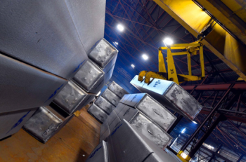 Scepter - tilted view of a storage room with aluminum rolling ingot being picked up by a crane
