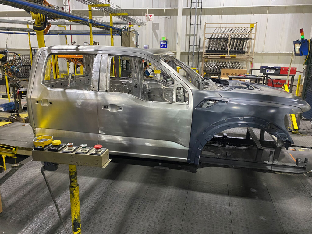 Figure 3. An F-150 crew cab moves through the quality inspection area on the assembly line.