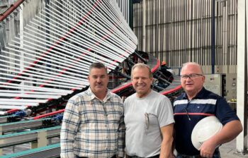 The vertical powder coating line at Tower Extrusions (L-R): James Lucas, project manager, Tower Extrusions; Tim Horist, North America service manager, SAT; and Lee Jones, finishing manager, Tower Extrusions.