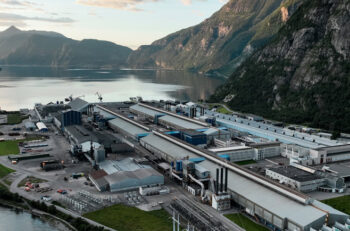 Aerial view of an aluminum smelter by a lake