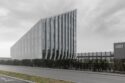 Bonfiglioli headquarters with a slanted roof and aluminum mesh facade