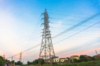 black electric tower under blue sky during daytime