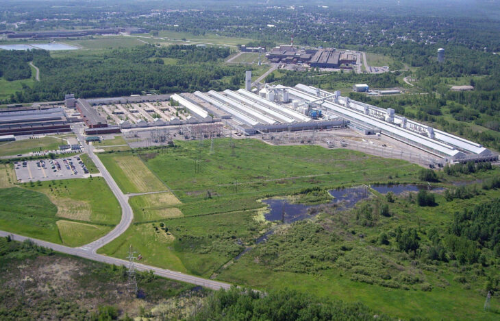 Aerial view of an industrial plant surrounded by green fields