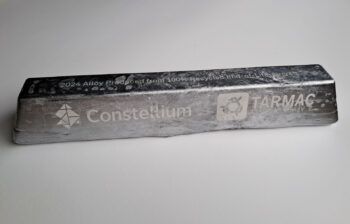 Aluminum ingot stamped with the logos and company names for Constellium and TARMAC Aerosave