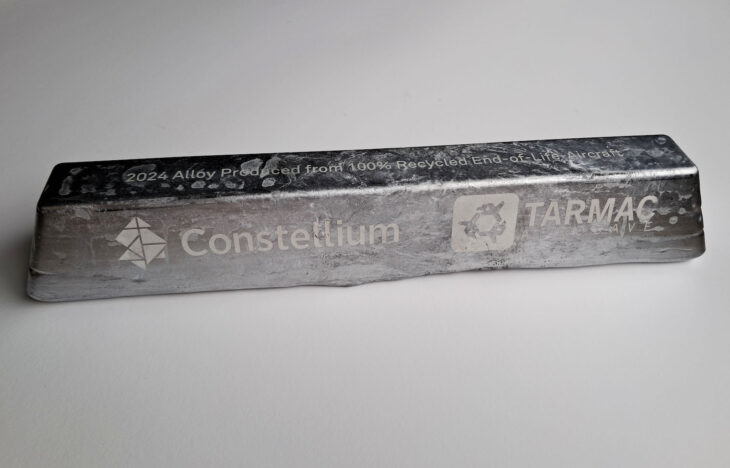 Aluminum ingot stamped with the logos and company names for Constellium and TARMAC Aerosave