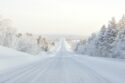 A road leading out into a snowy landscape in Finland