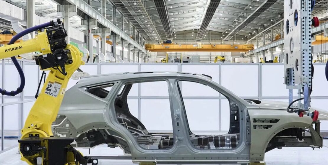 An aluminum spaceframe on a vehicle assembly line.