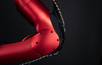 a close up of a red bike with a black background