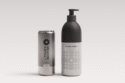 Two aluminum cans — one beverage and one pump for soap