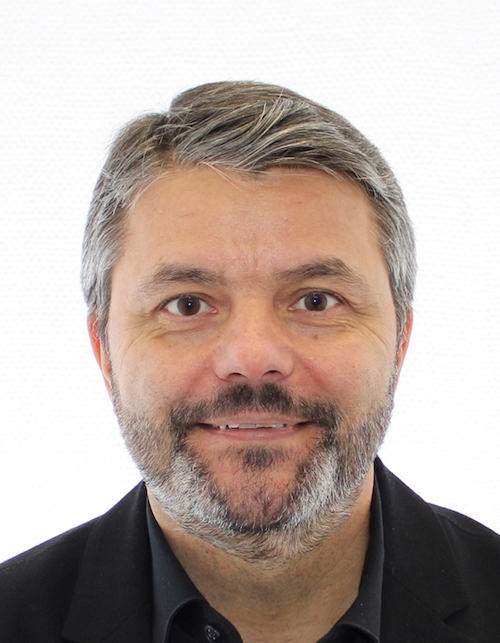 Headshot of a man with a beard.