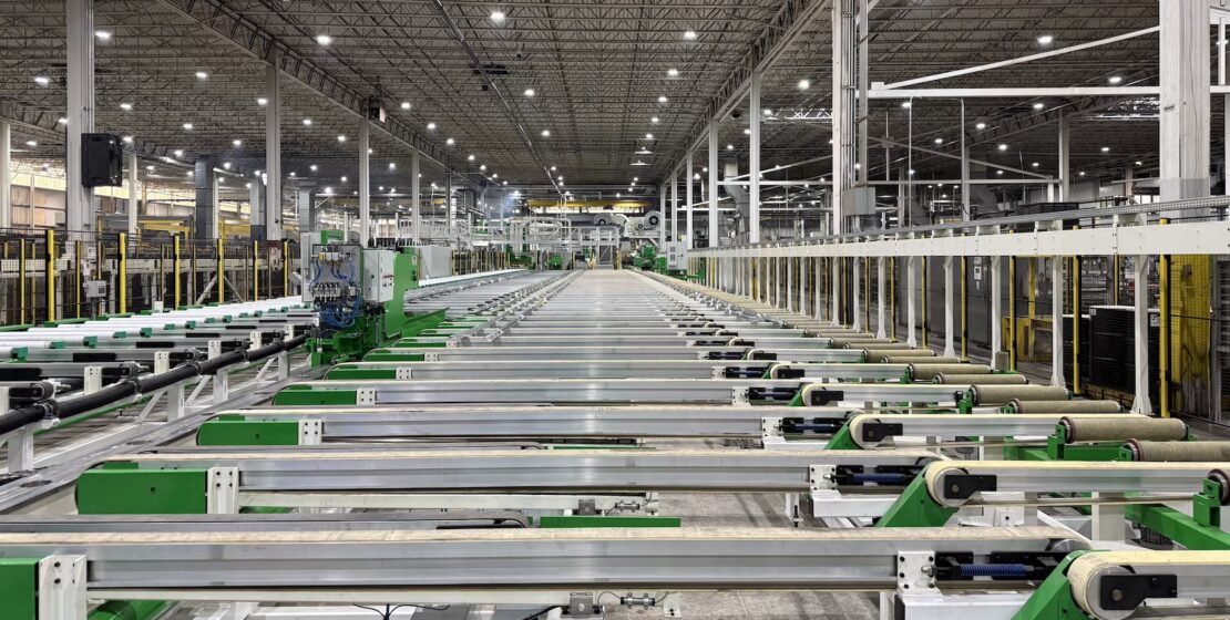 A view of the cooling tables and stretcher area of an extrusion press line.