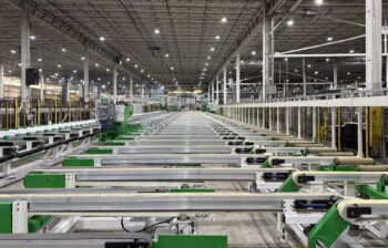 A view of the cooling tables and stretcher area of an extrusion press line.