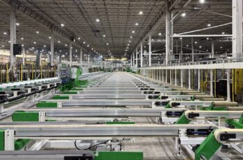 A view of the cooling tables and stretcher area of an extrusion press line.